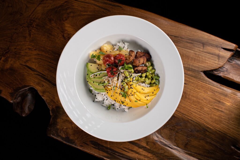 a bowl of food on a wood surface