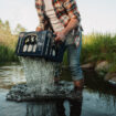 a man pouring water into a box
